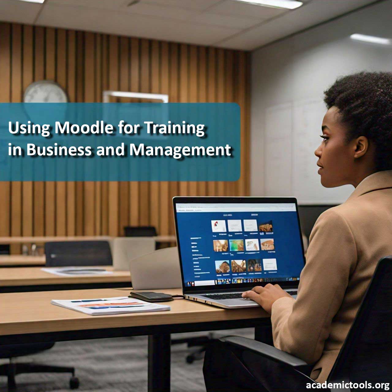 Person using Moodle on a laptop for business and management training in a modern office setting.