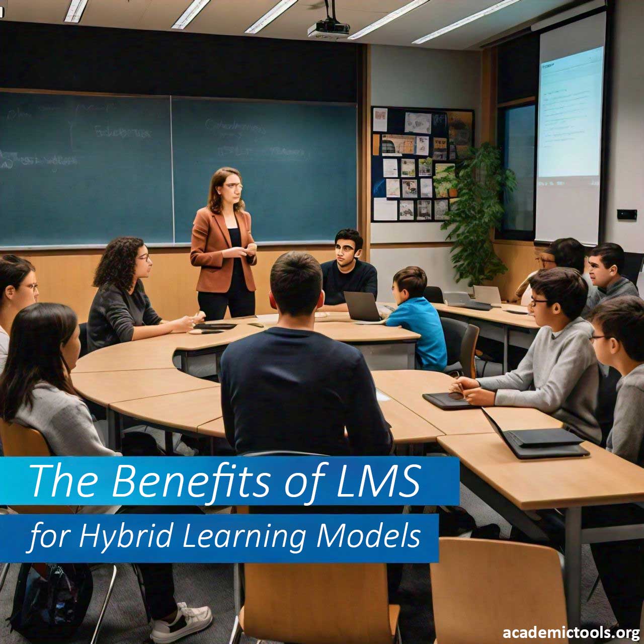 Classroom with students and instructor discussing ‘The Benefits of LMS for Hybrid Learning Models’ on a presentation screen.